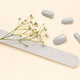Gray fake nails and nail file with small flowers