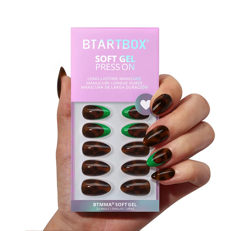 Emerald green nails with gold accents